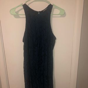 Sleeveless blue lace dress with black underlay
